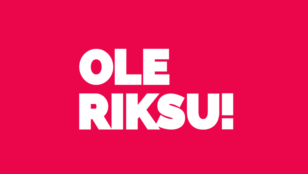 Ole Riksu! Valkoinen teksti punaisella pohjalla